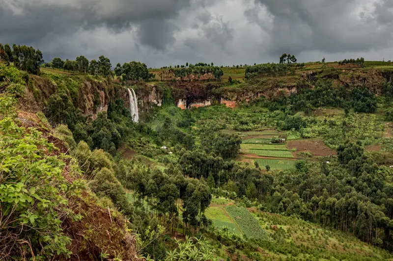 Hiking the Sipi Falls on Mount Elgon follwing the trail to the upper falls enjoying this amazing view