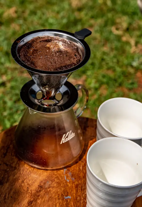 coffee brewing during coffee tour experience in Sipi