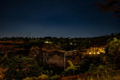 night photo of the sipi falls, sky, stars, lights 